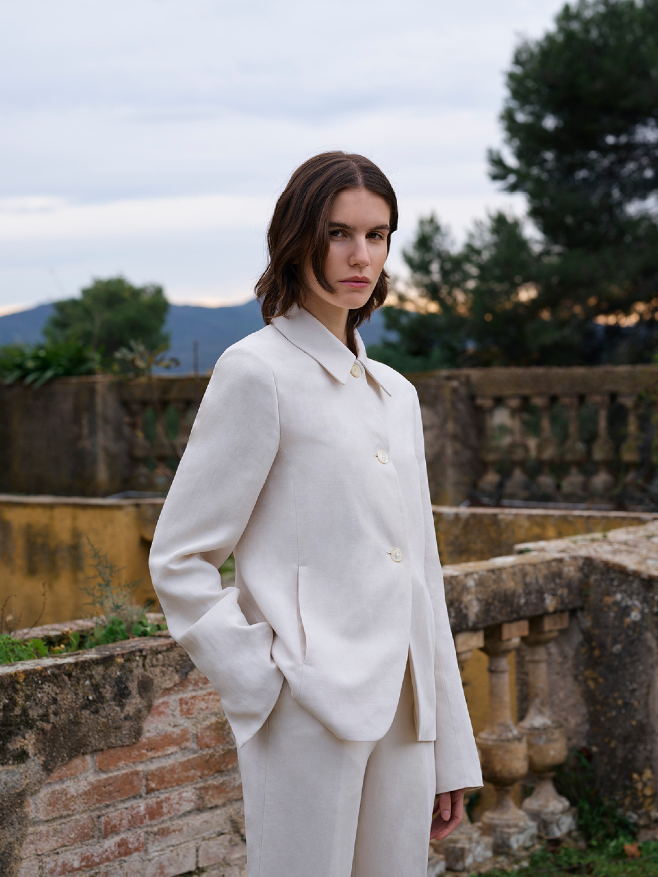 woman in off white suit